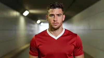 Mid-30s muscular forward, waist-up, intense gaze, dark red jersey with crisp white collar, plain cotton texture, subtle...