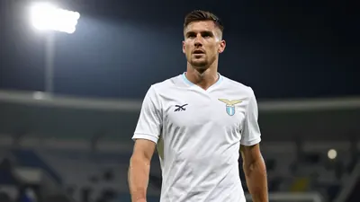 A 26-year-old Croatian defender with a strong build, wearing a solid white jersey, photographed with an 85mm f/1.4 lens...